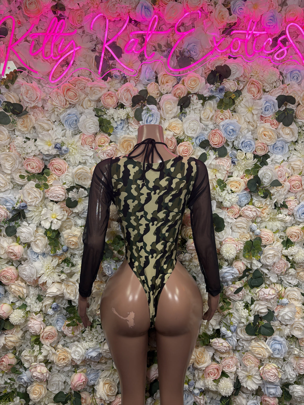 Sheer black lace-up bodysuit with olive snakeskin print and long sleeves