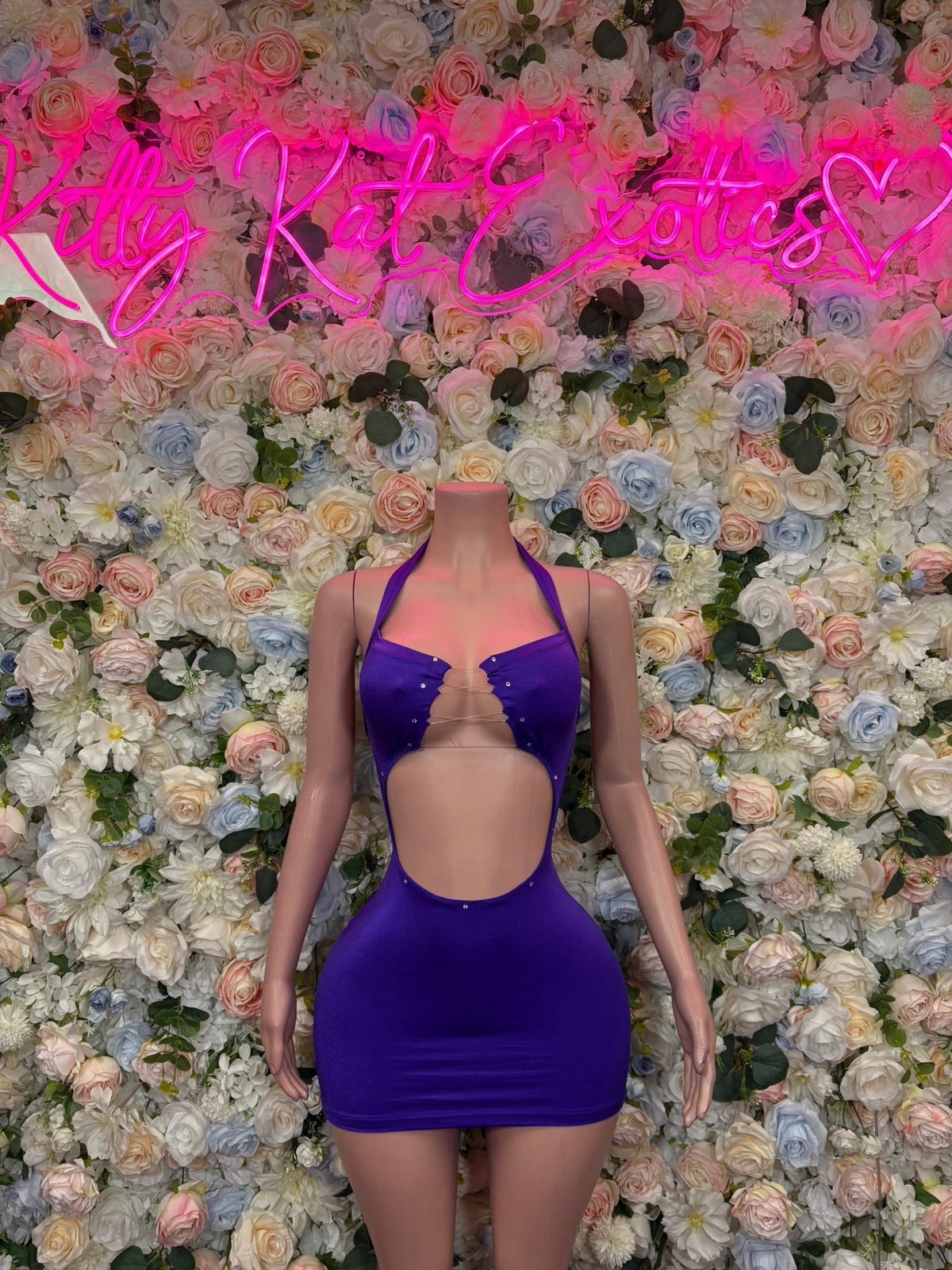 Purple mini dress with deep V neckline and cutout bodice with thin straps