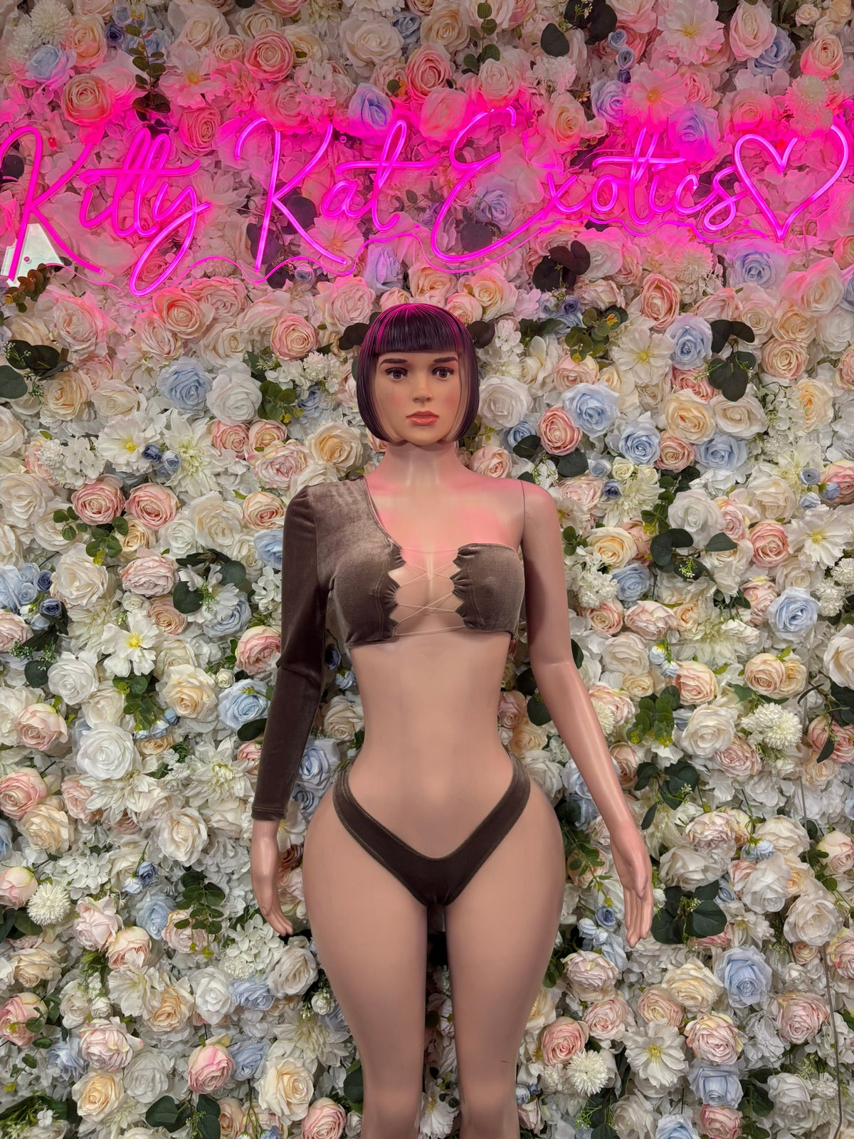 Chocolate brown asymmetric cutout one-piece bodysuit, front view