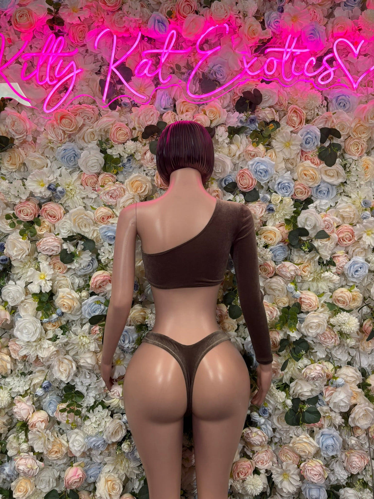Chocolate brown asymmetric cutout one-piece bodysuit, back view