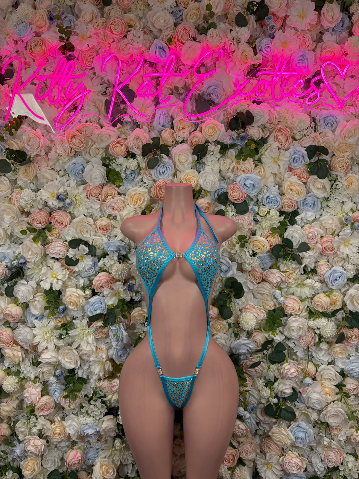 Turquoise leopard-print rhinestone bodysuit with halter neckline and thong back
