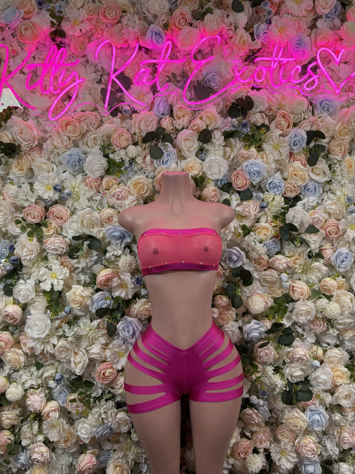 Pink bandeau and high-waist shorts set with striped cutouts, back view
