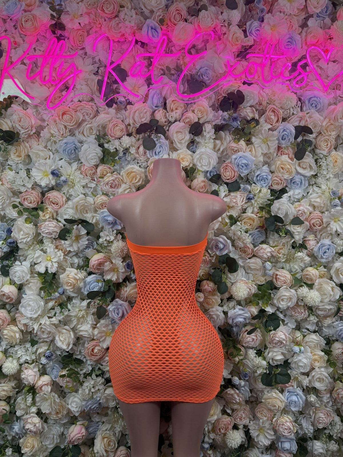 Neon orange fishnet cutout mini dress, open back with V-shaped cutouts
