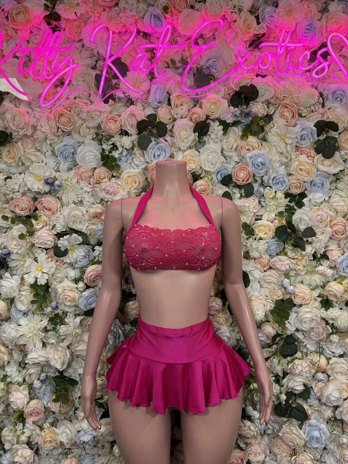Hot pink halter top and ruffle skirt set with a beaded top and flared skirt, front view