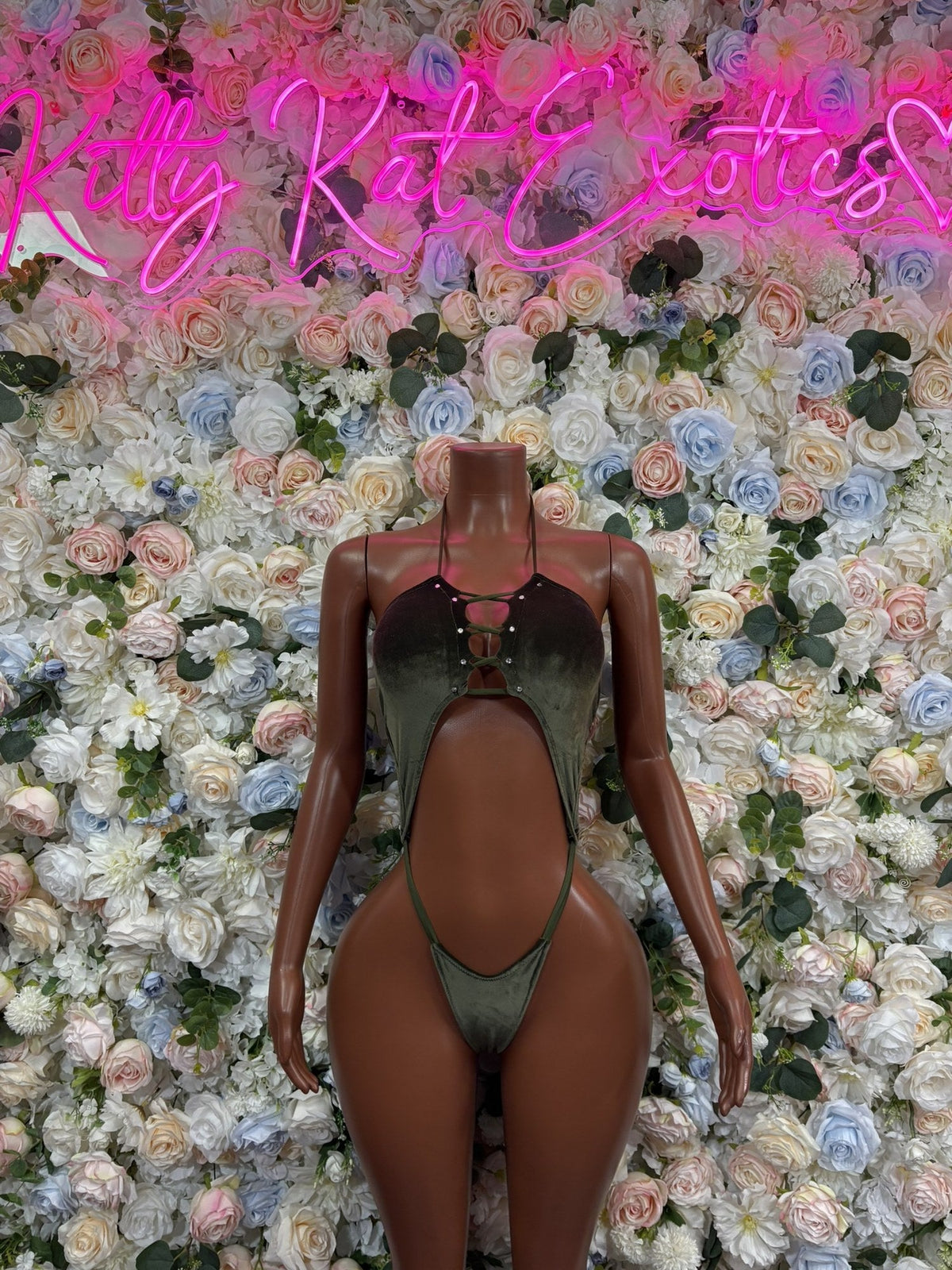 Olive green glitter two-piece clubwear set with a halter top and high-cut bottoms