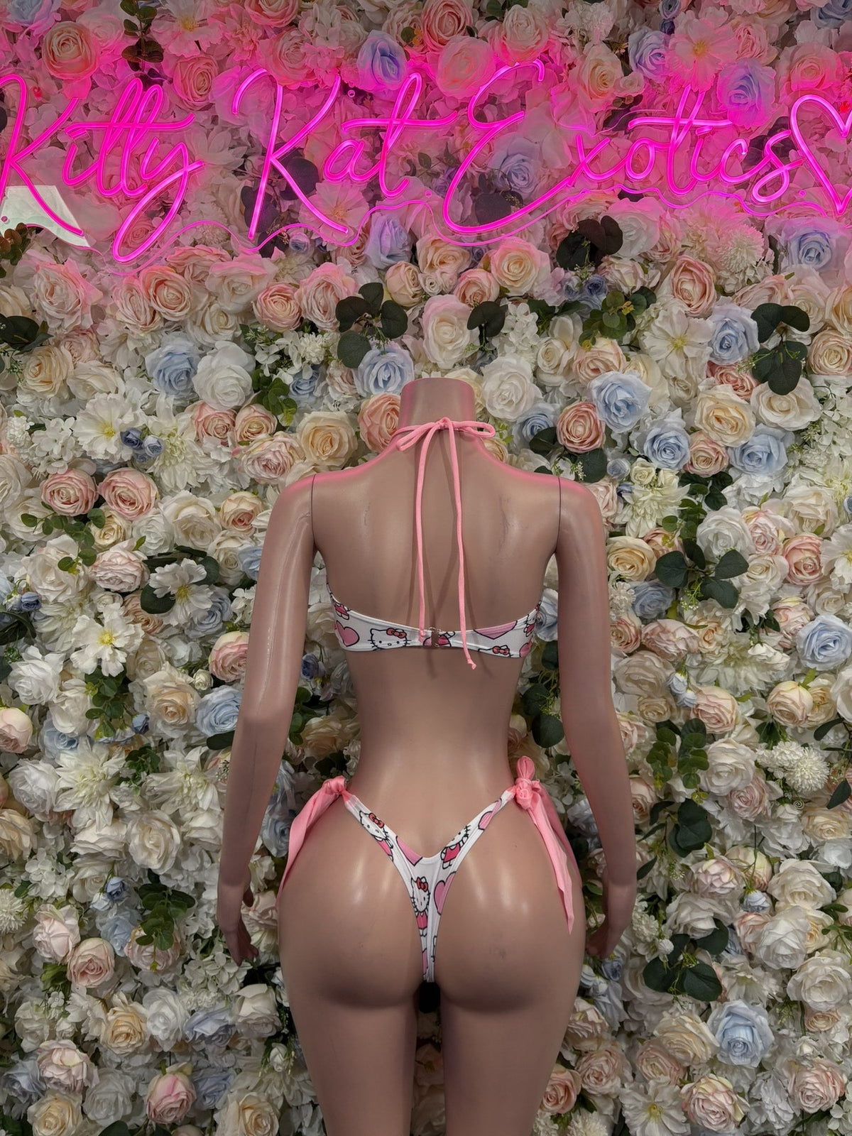 Back view of pink print triangle bikini set with halter ties and tie-side bottoms
