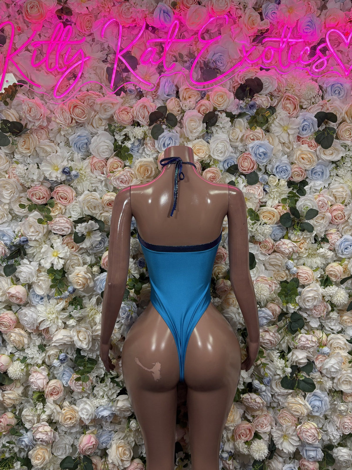 Blue bodysuit back with a tie neck and high-cut thong bottom