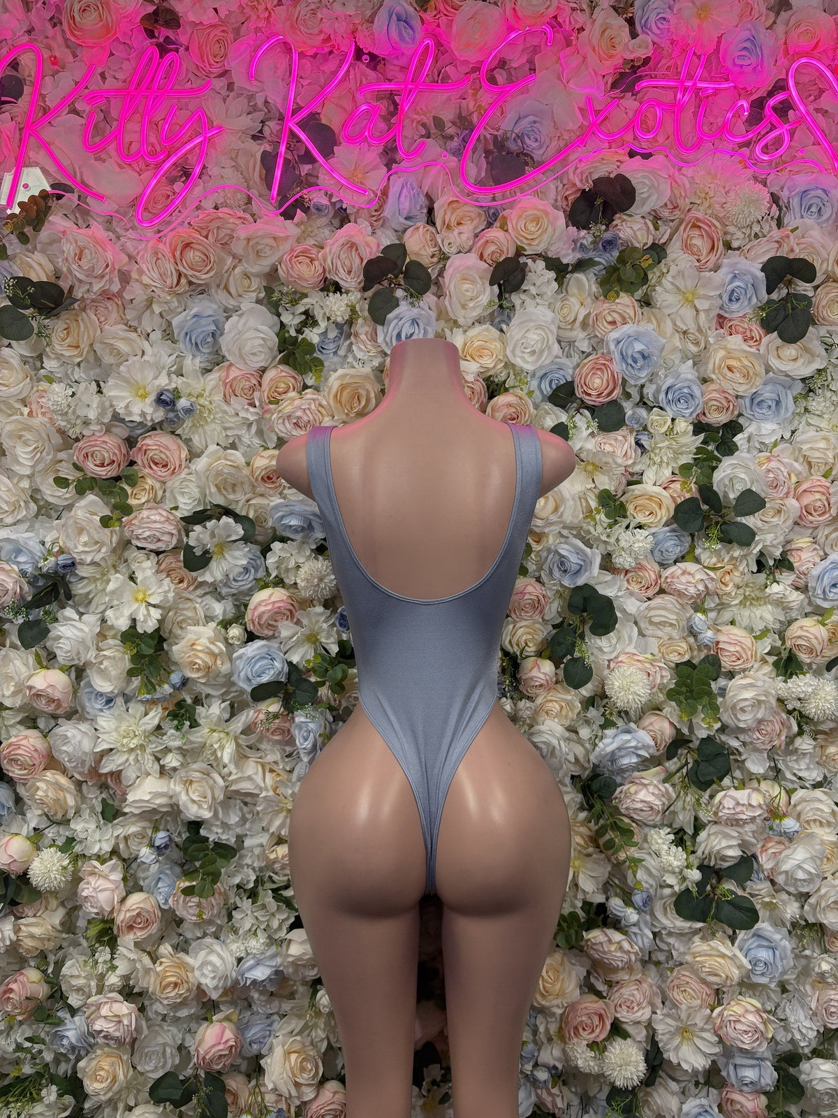 Lavender blue bodysuit back with a low scoop and narrow thong bottom