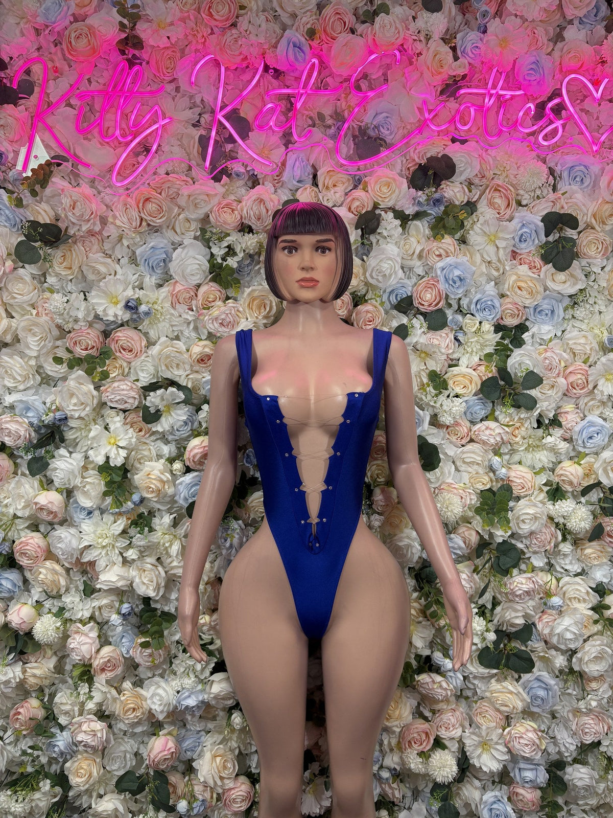 Royal blue deep-V cutout bodysuit with narrow straps and front lacing