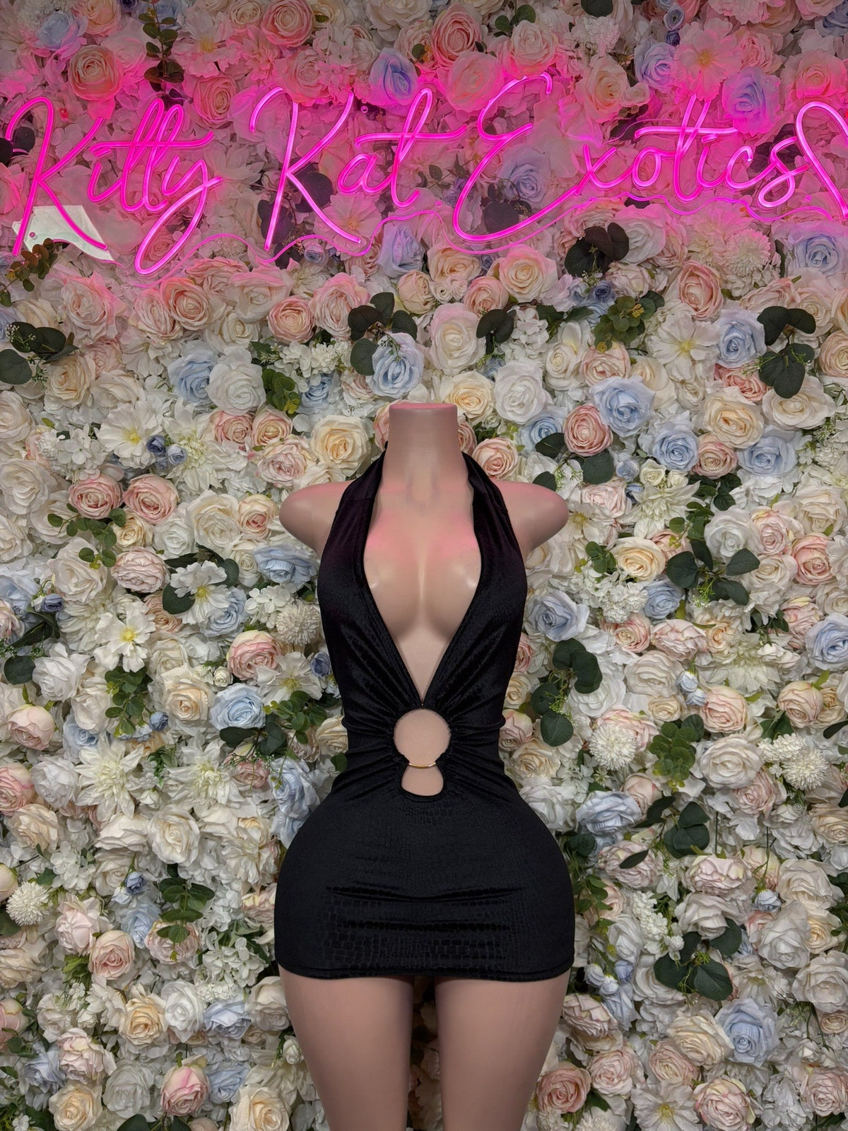 Black mini dress with halter neckline and circular chest cutout