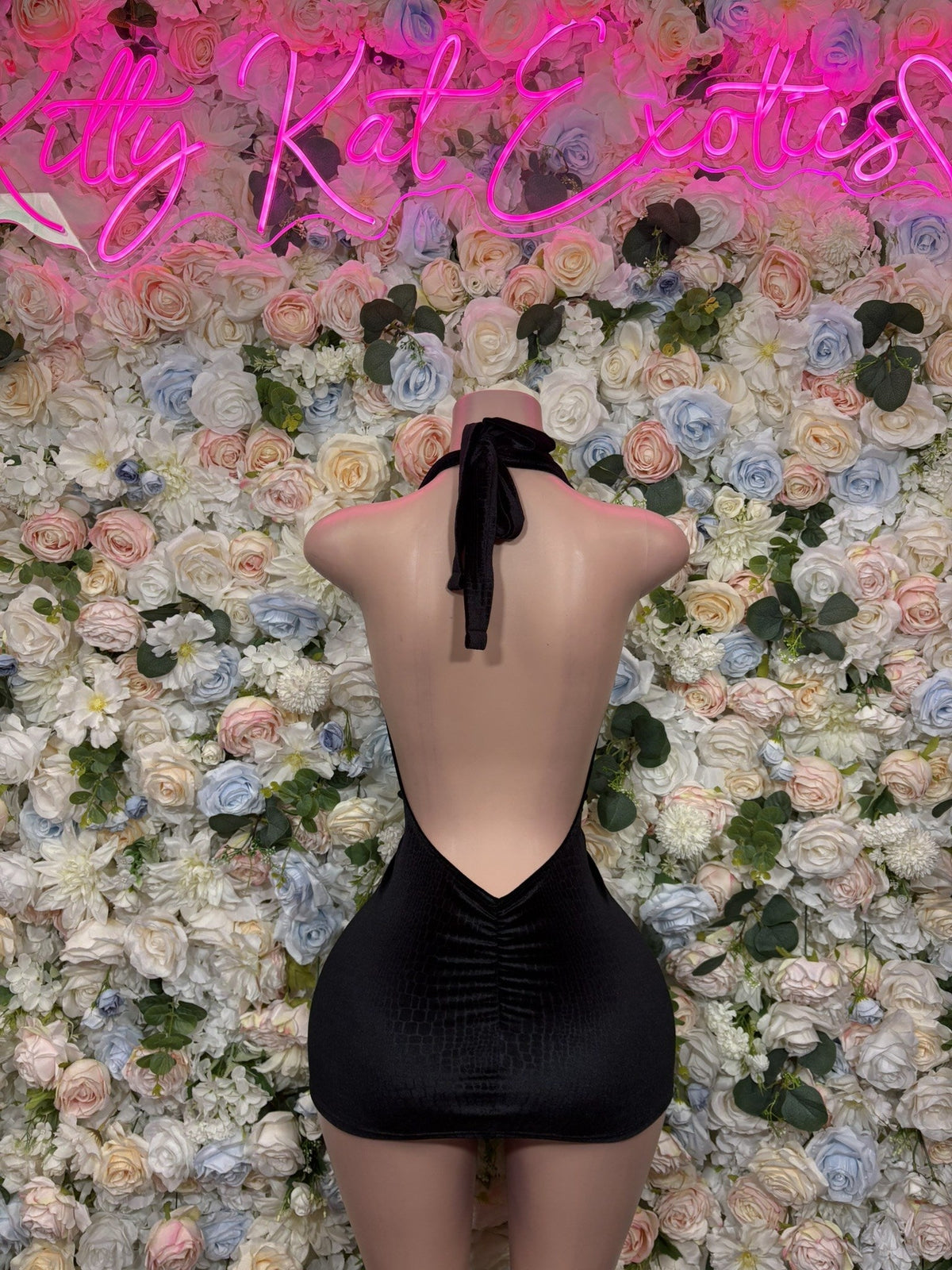 Black mini dress with back cutout and halter tie straps