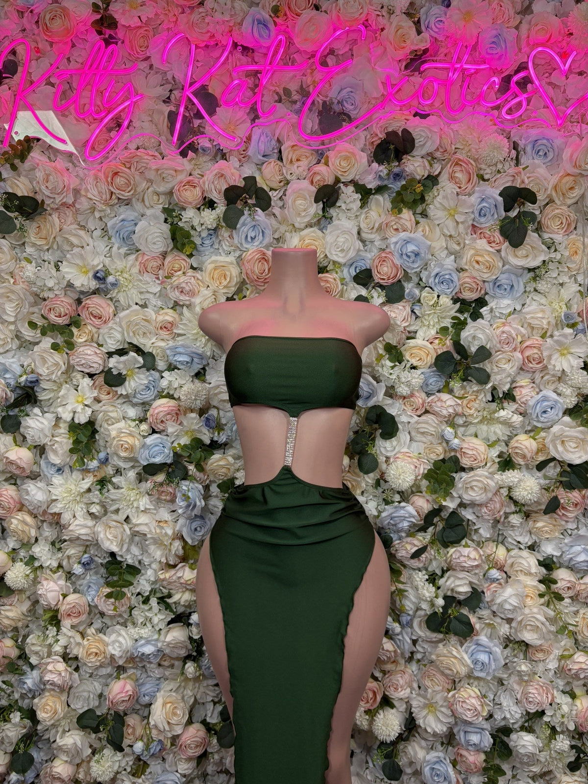 Dark green strapless crop top and fitted maxi gown, long column silhouette.