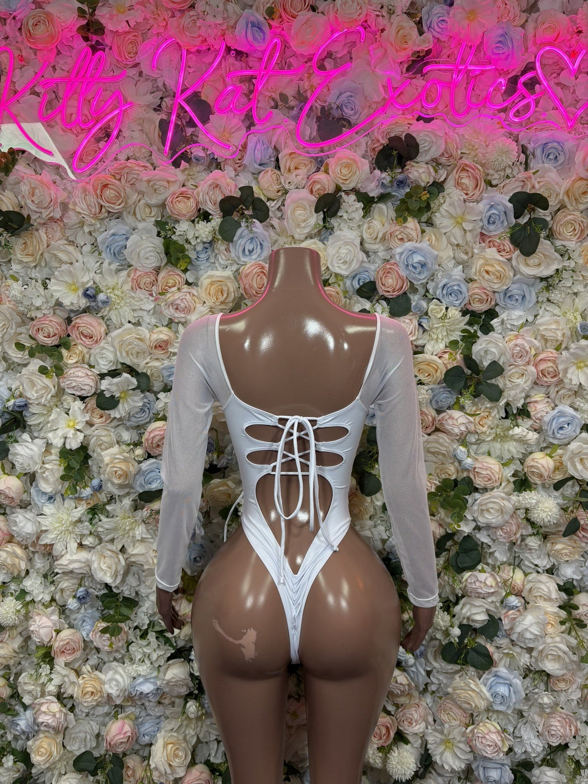 White lace-up long-sleeve bodysuit with deep V neckline, front corset-style lacing