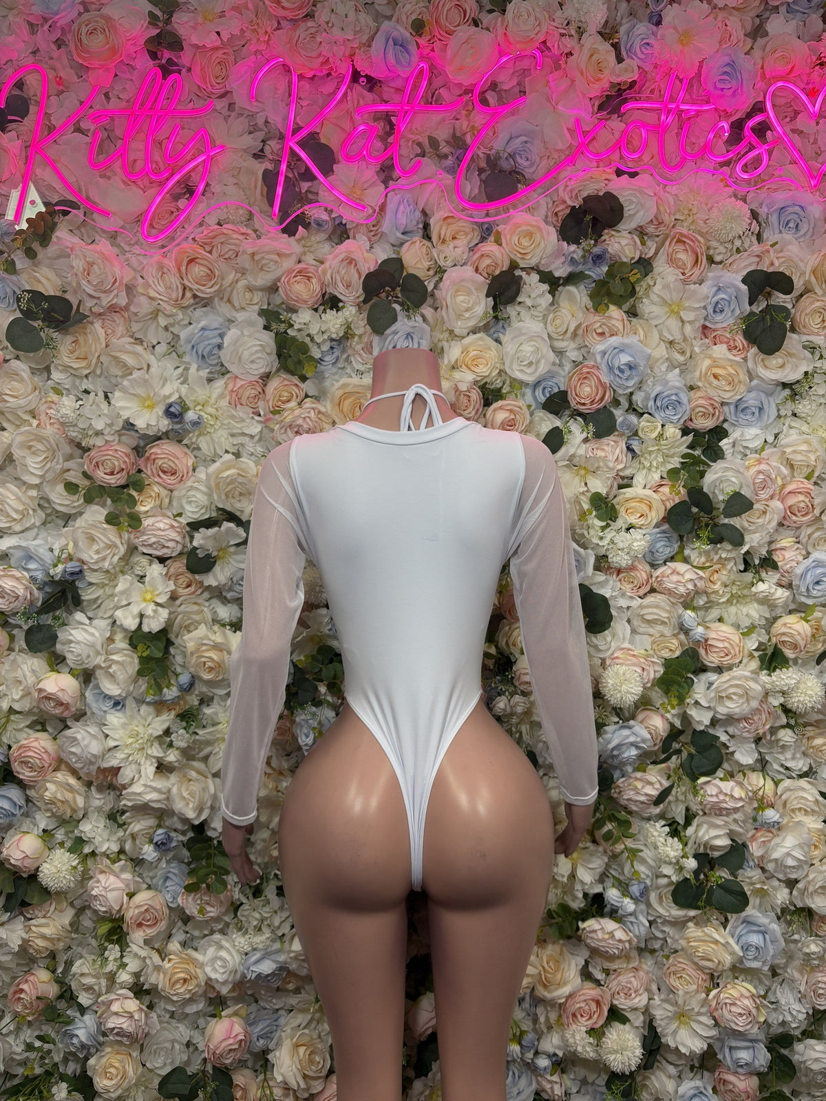 White iridescent lace-up bodysuit with long sleeves, back view
