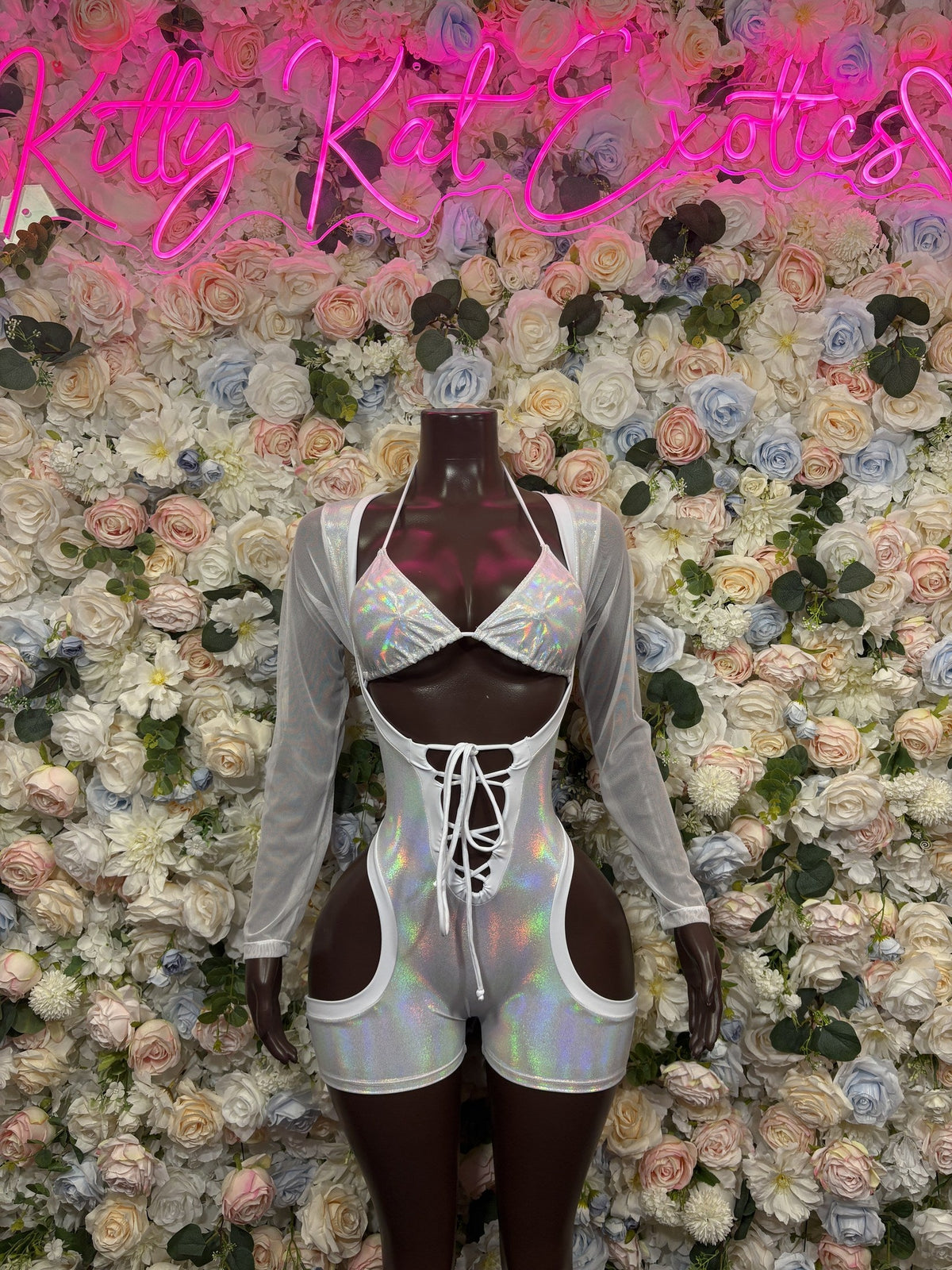 Iridescent white cutout bodysuit with shorts, long sleeves, crisscross front lacing