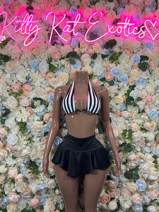 Front view of striped halter bra top with black ruffle mini skirt