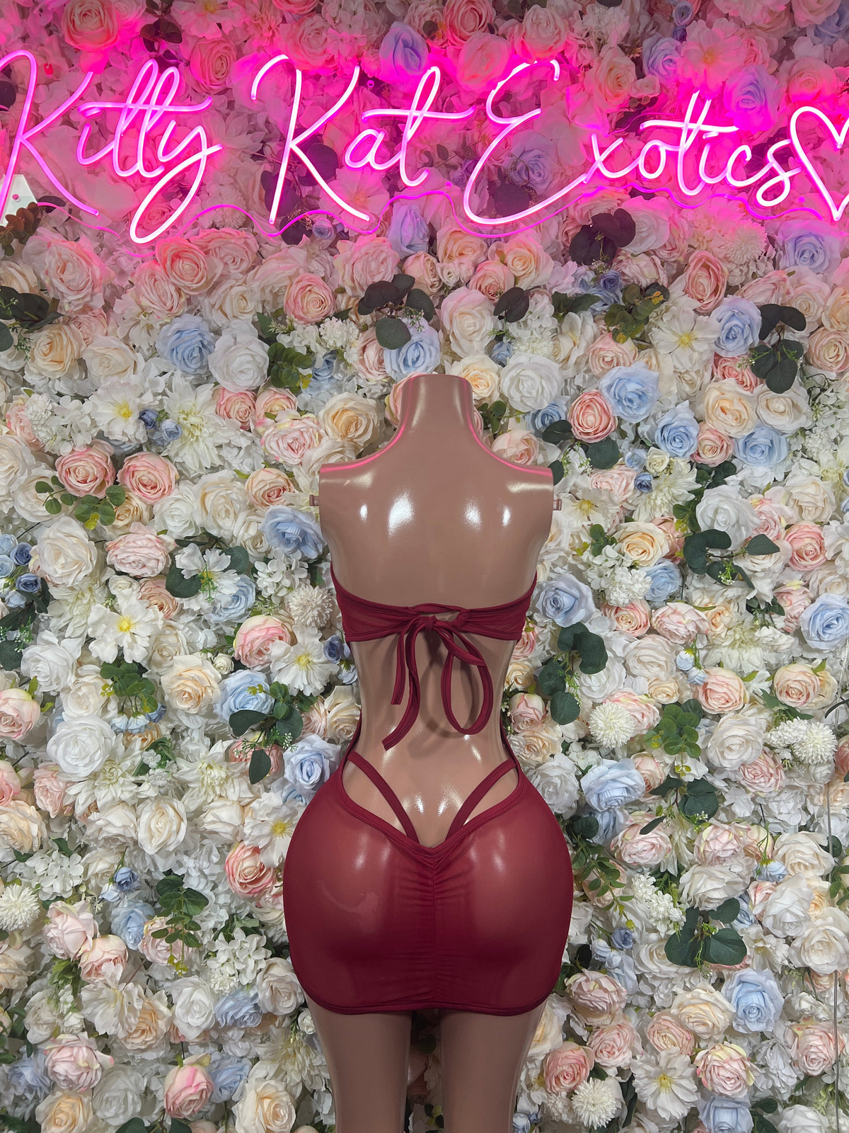 Strapless maroon cutout mini dress with lace-up back and V-shaped neckline