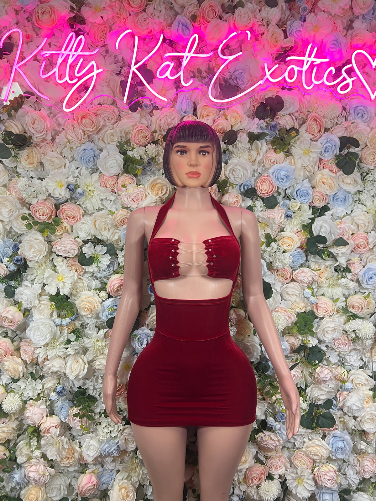 Burgundy strapless mini dress with center front detailing and cutout sides