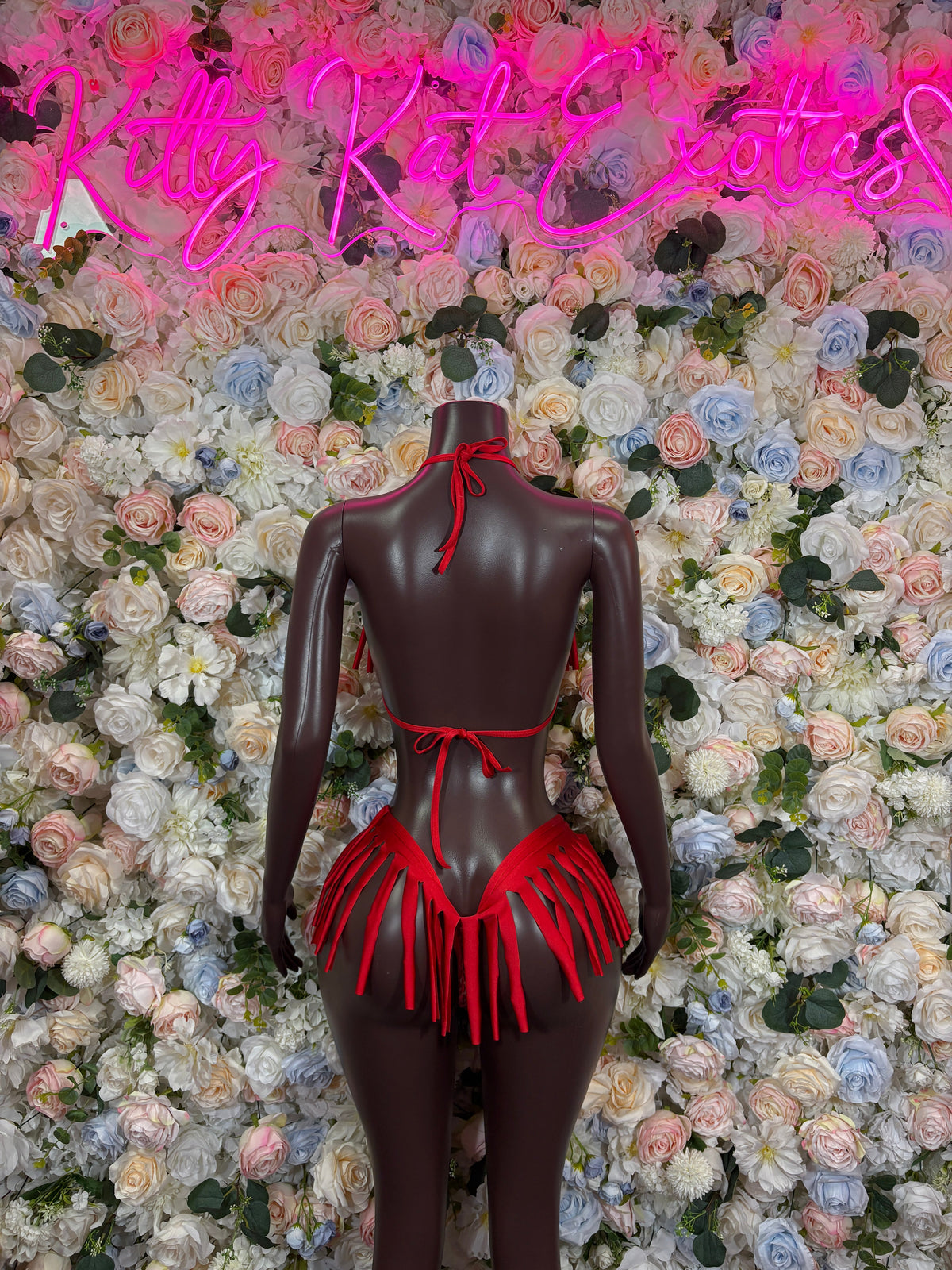 Red rhinestone asymmetrical bikini top and high-cut bottom with red fringe ties