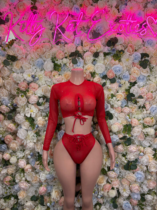 Red strappy bikini set with long-sleeve sheer crop top and matching high-leg bikini bottoms