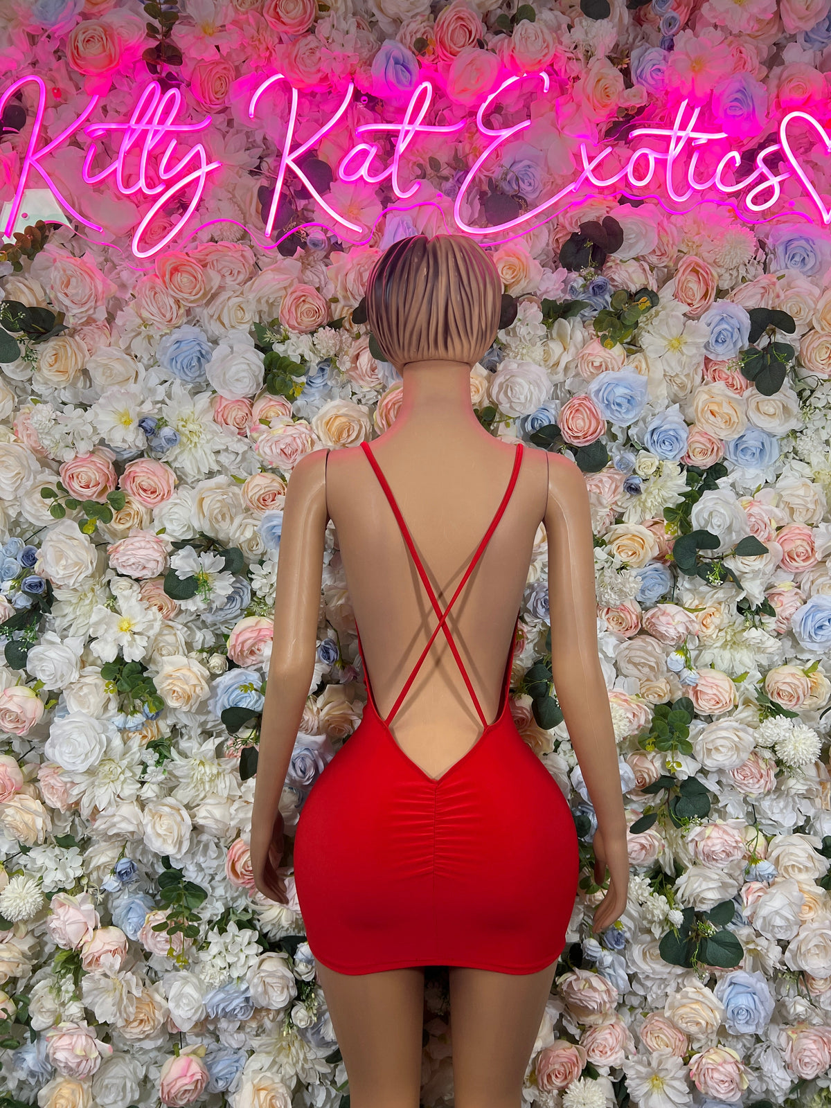 Red mini dress with crisscross spaghetti straps and low back neckline