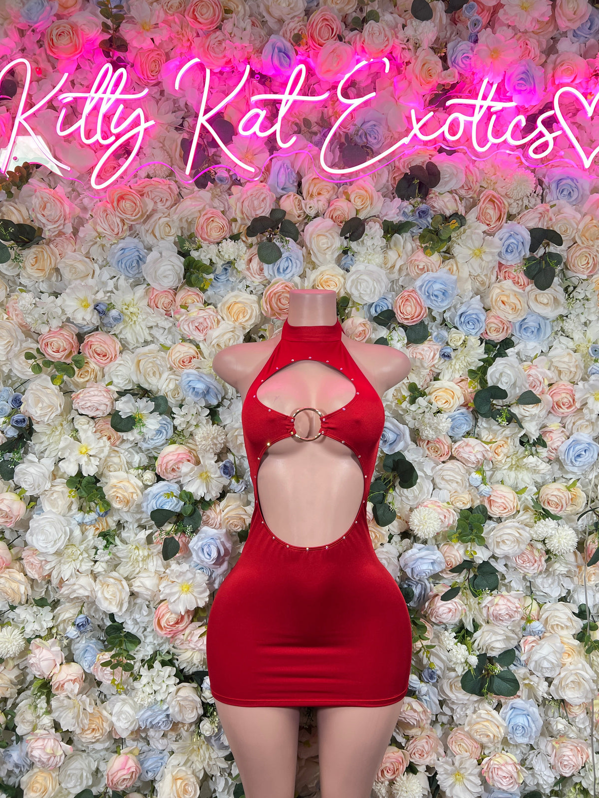 Red halter cutout mini dress with circular ring accent at neckline