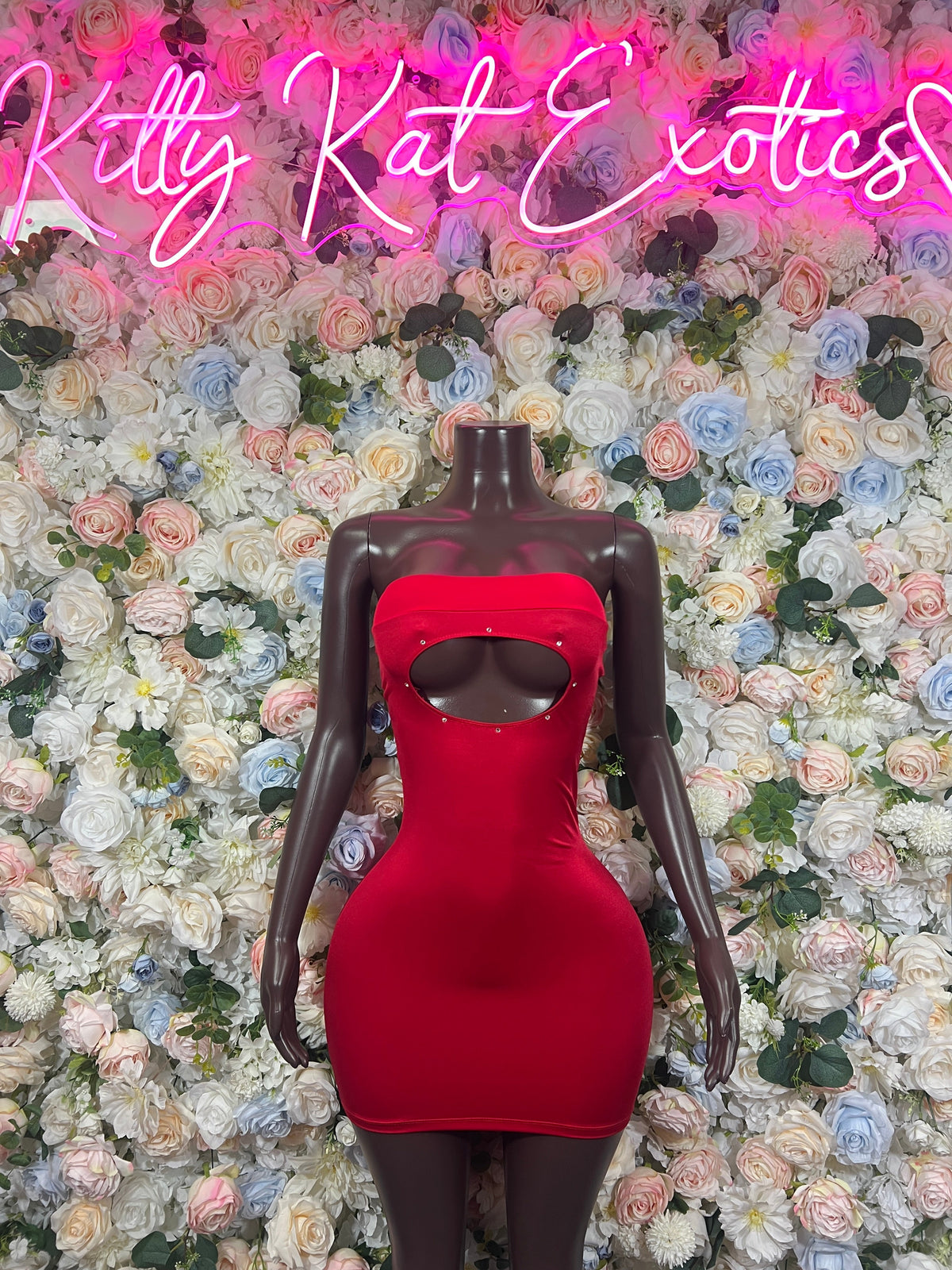 Red halter mini dress on mannequin, sweetheart neckline