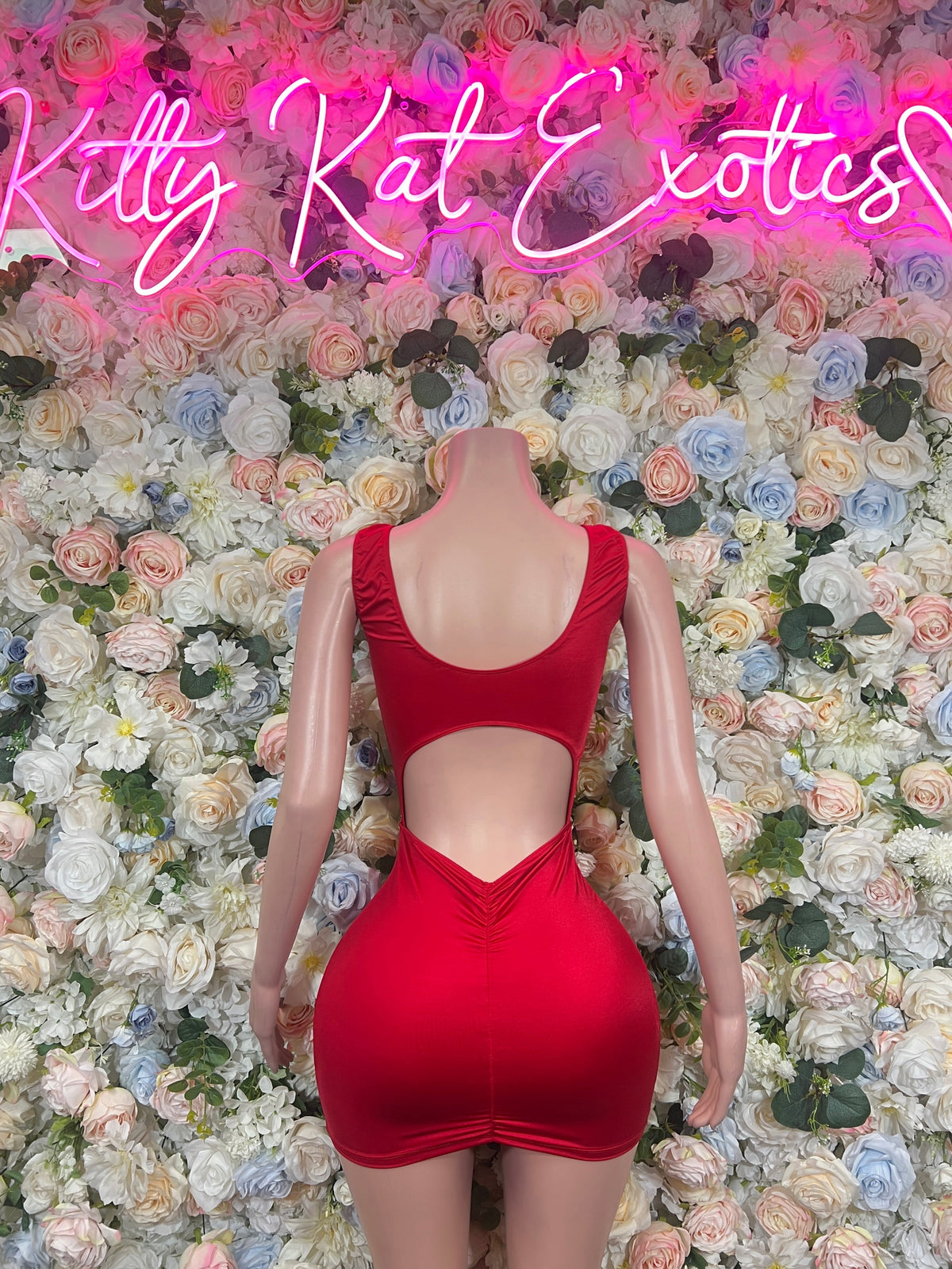 Ruched red mini dress with scoop back and side cutouts