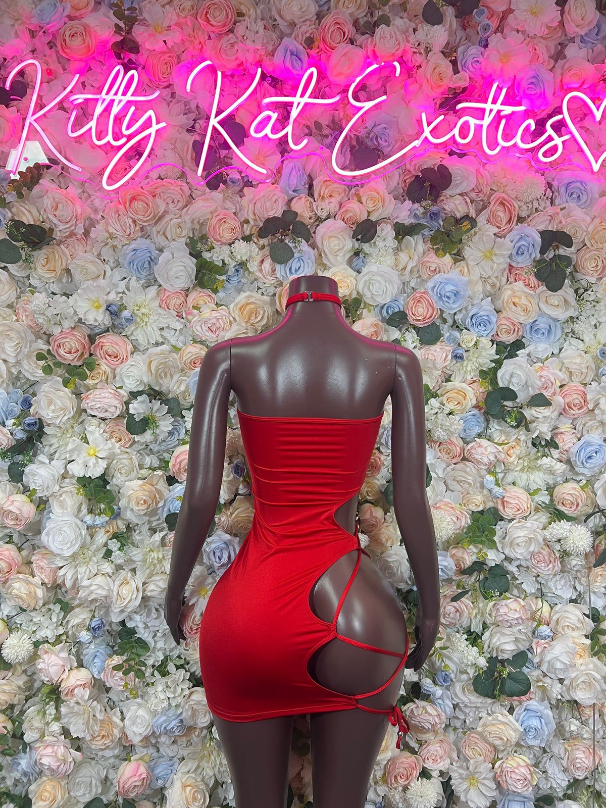 Red bodycon mini dress with ruched back and side cutout