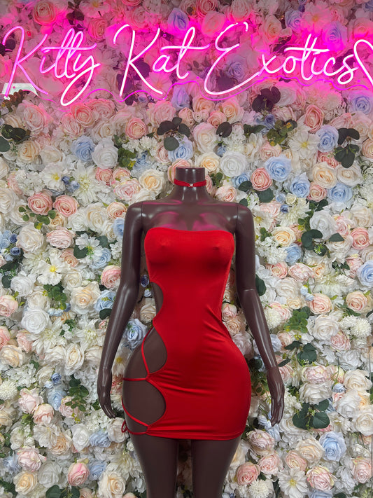 Red bodycon mini dress with side hip cutouts and ruched bodice