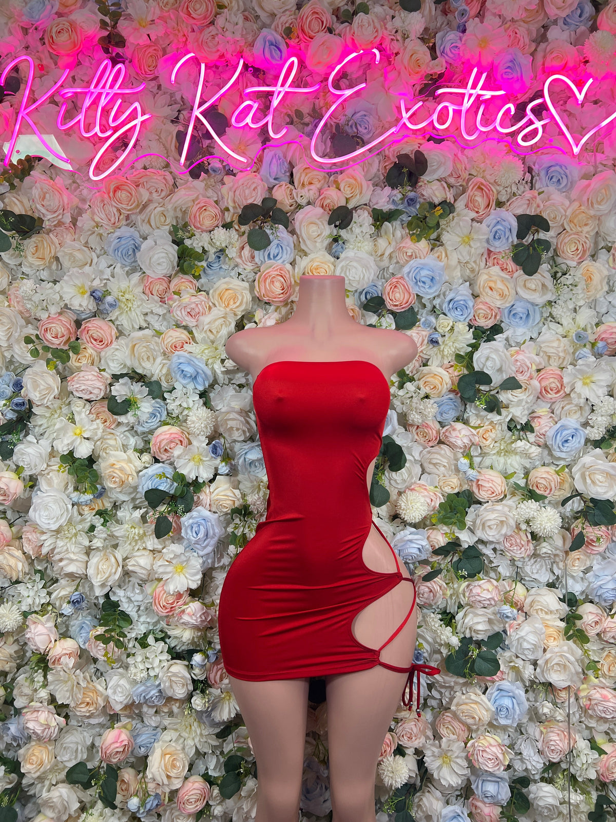 Red strapless mini dress with ruched bodice and side cutout