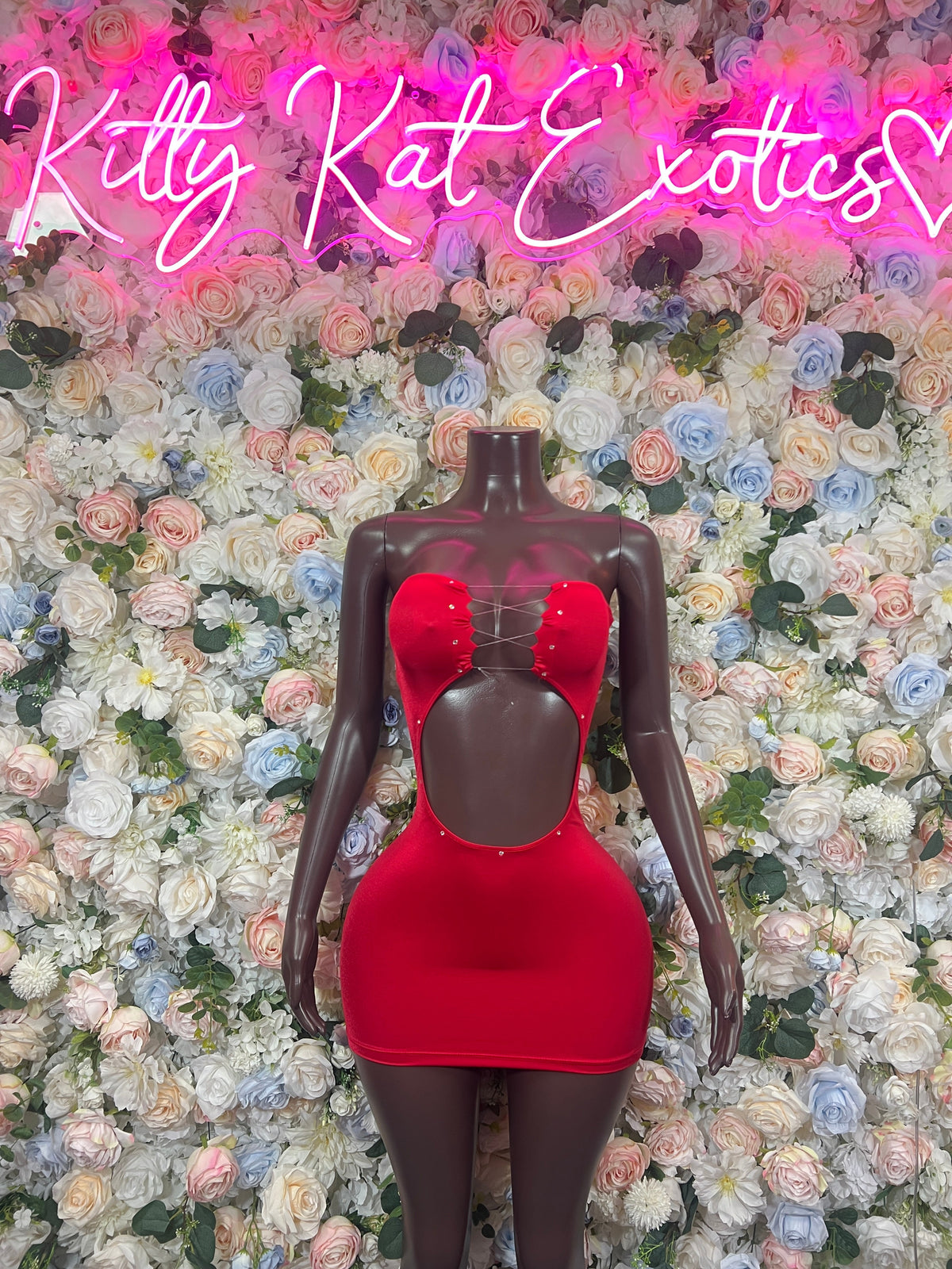 Red cutout mini dress with rhinestone chest detail, front view on mannequin