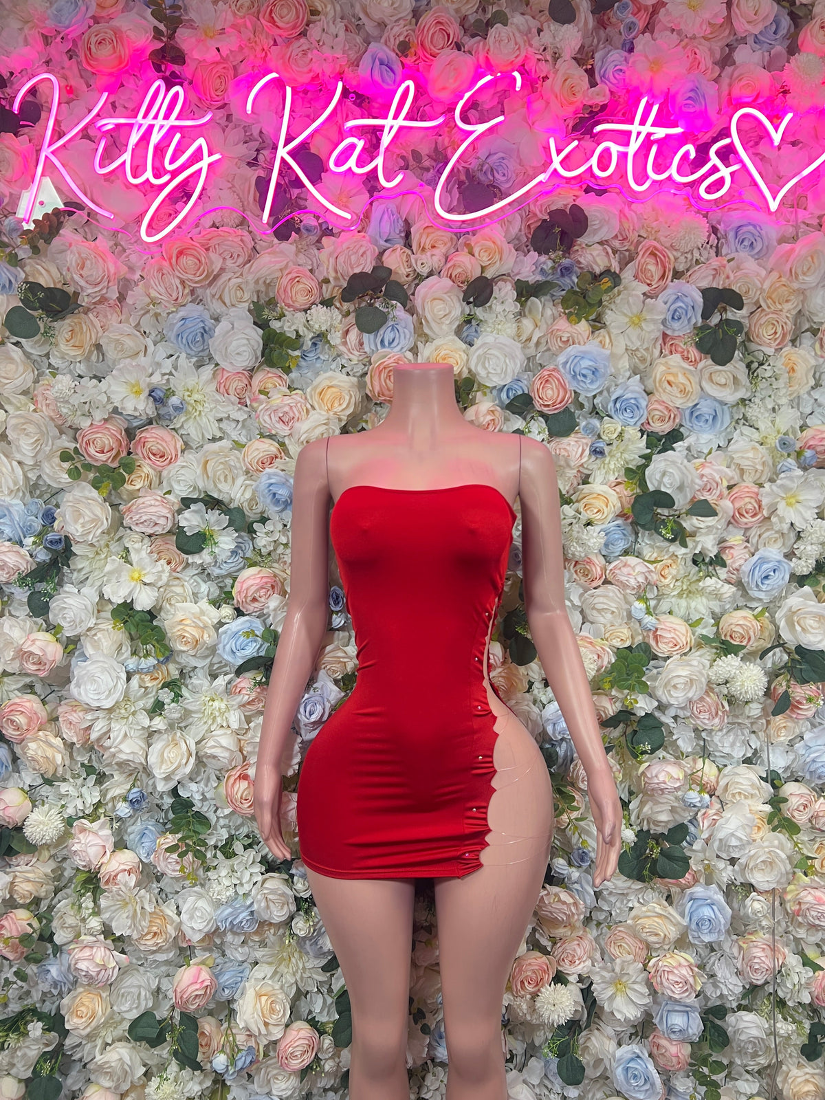 Red strapless ruched bodycon mini dress on mannequin