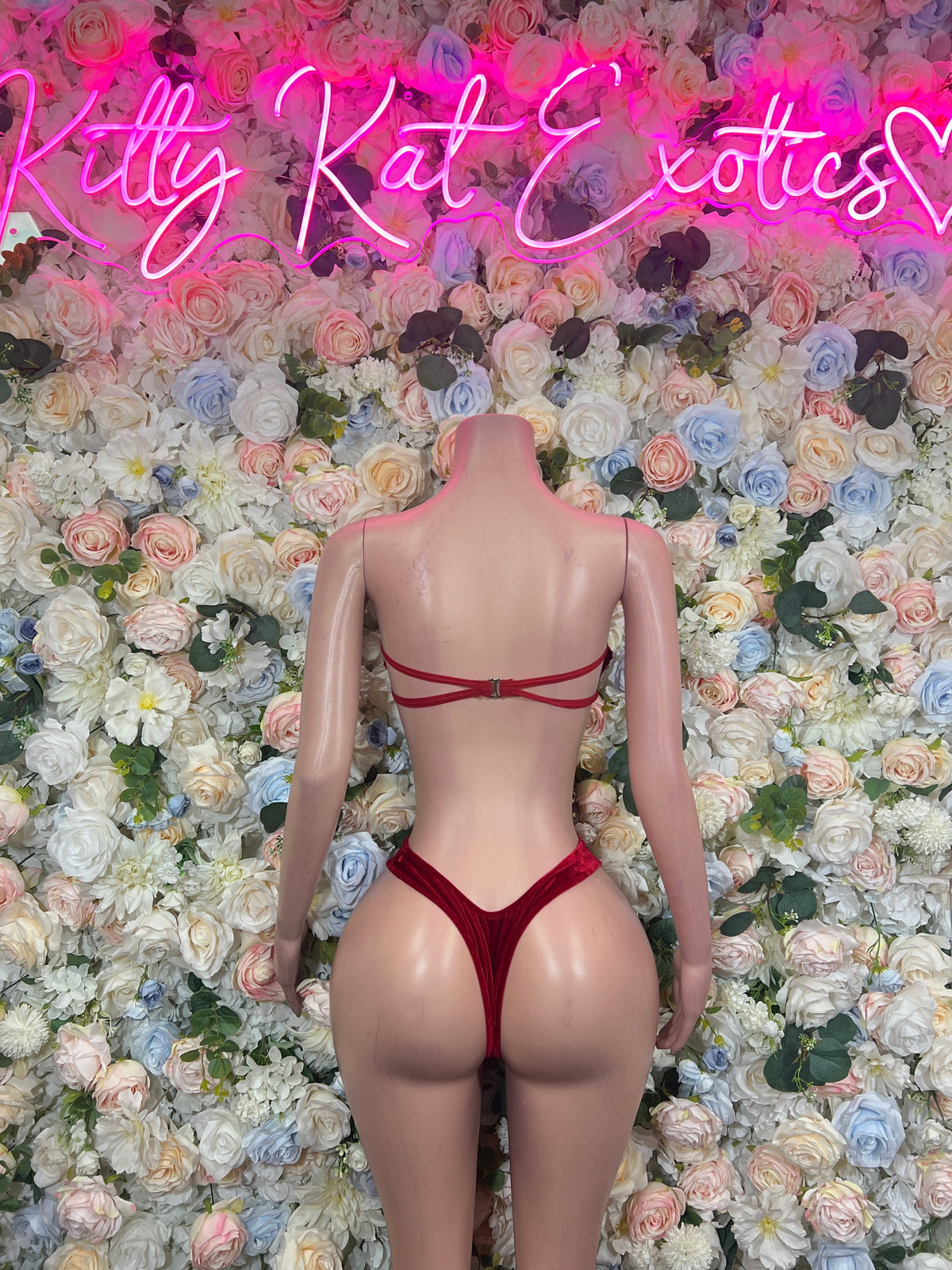 Red sequined cutout bandeau bikini set shown from the back with tie straps