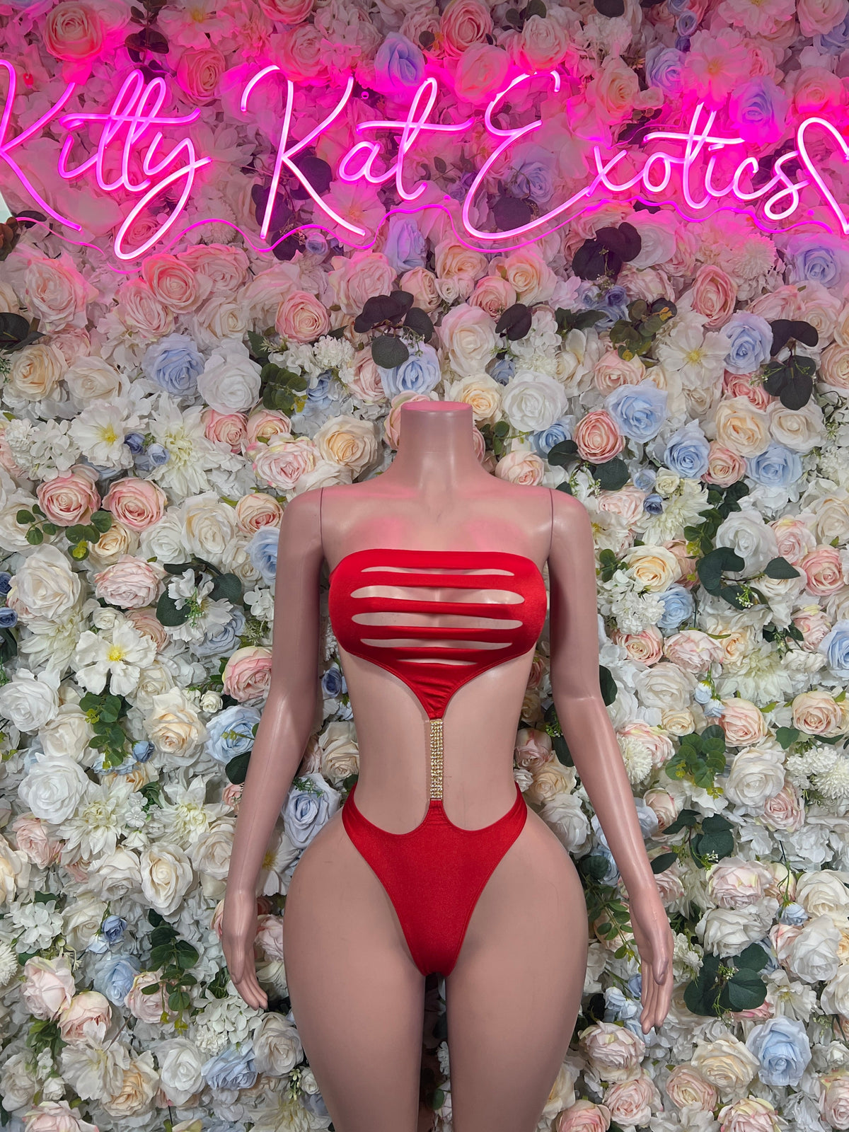 Red strappy cutout one-piece bodysuit, front view with horizontal striped cutouts