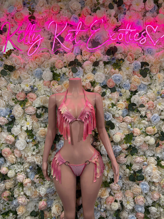 Pink rhinestone fringe bikini two-piece with tassel skirt on mannequin, strappy design