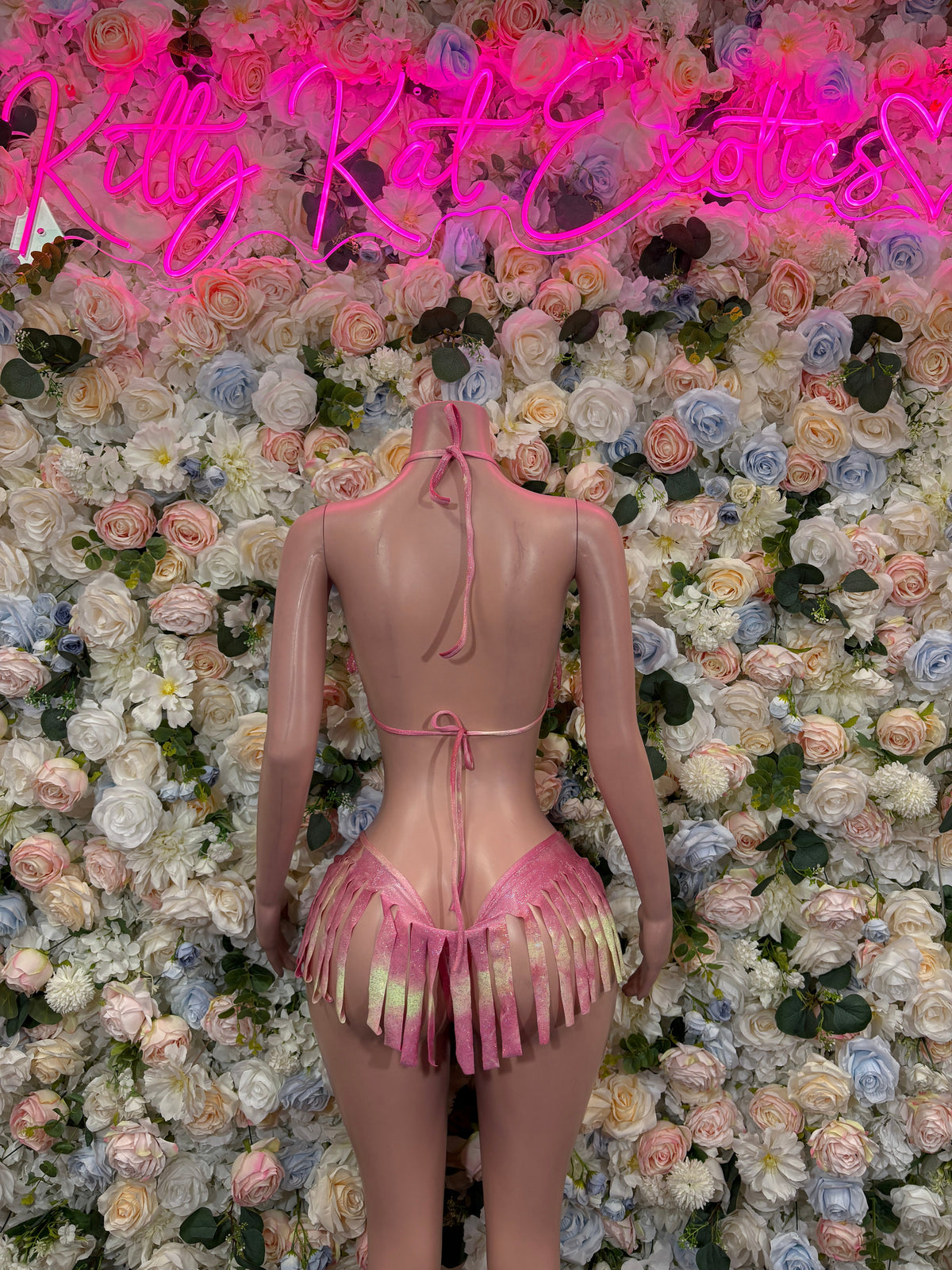 Pink rhinestone fringe bikini two-piece, back view with tied straps and tassel skirt
