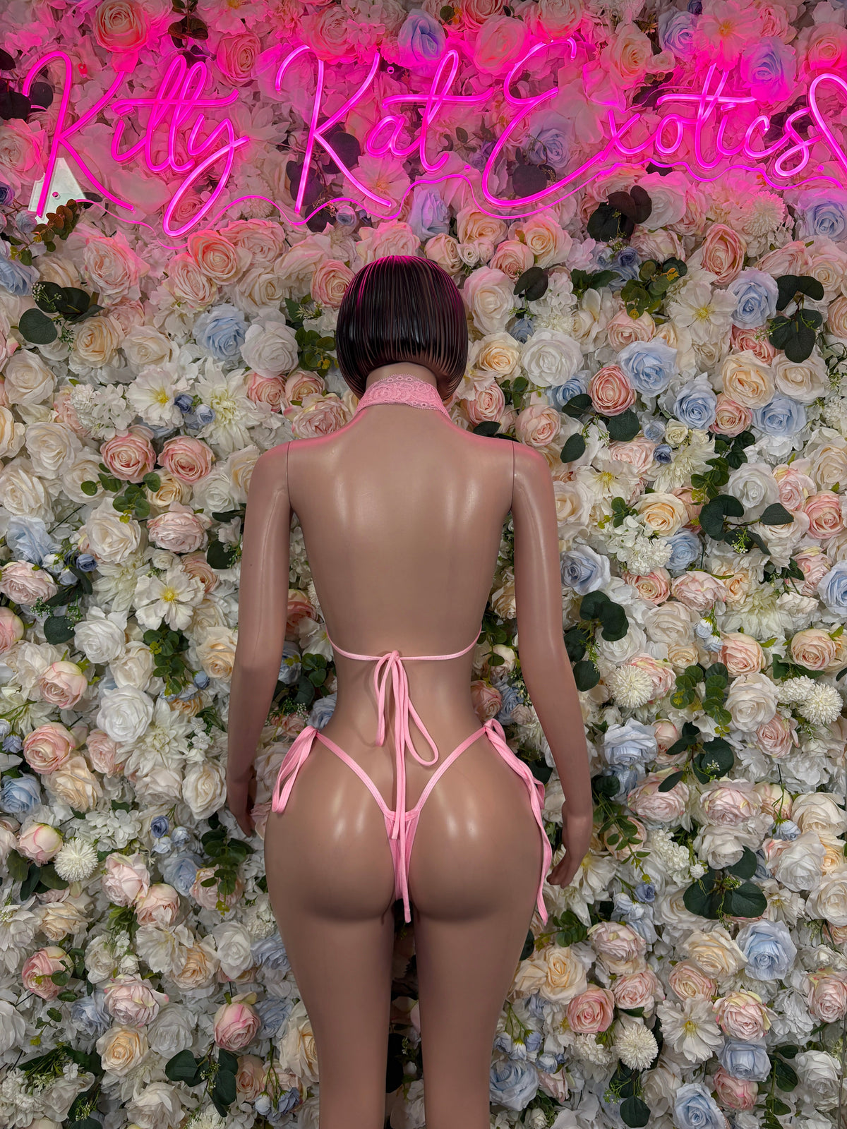 Pink lace halter bikini set, back view with tied strings and open back