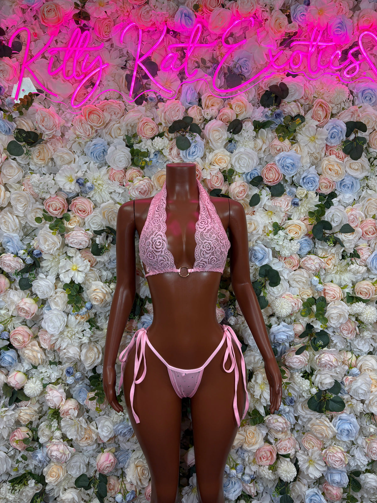 Baby pink lace plunge bikini set with halter top and tie-side bottoms, front view.
