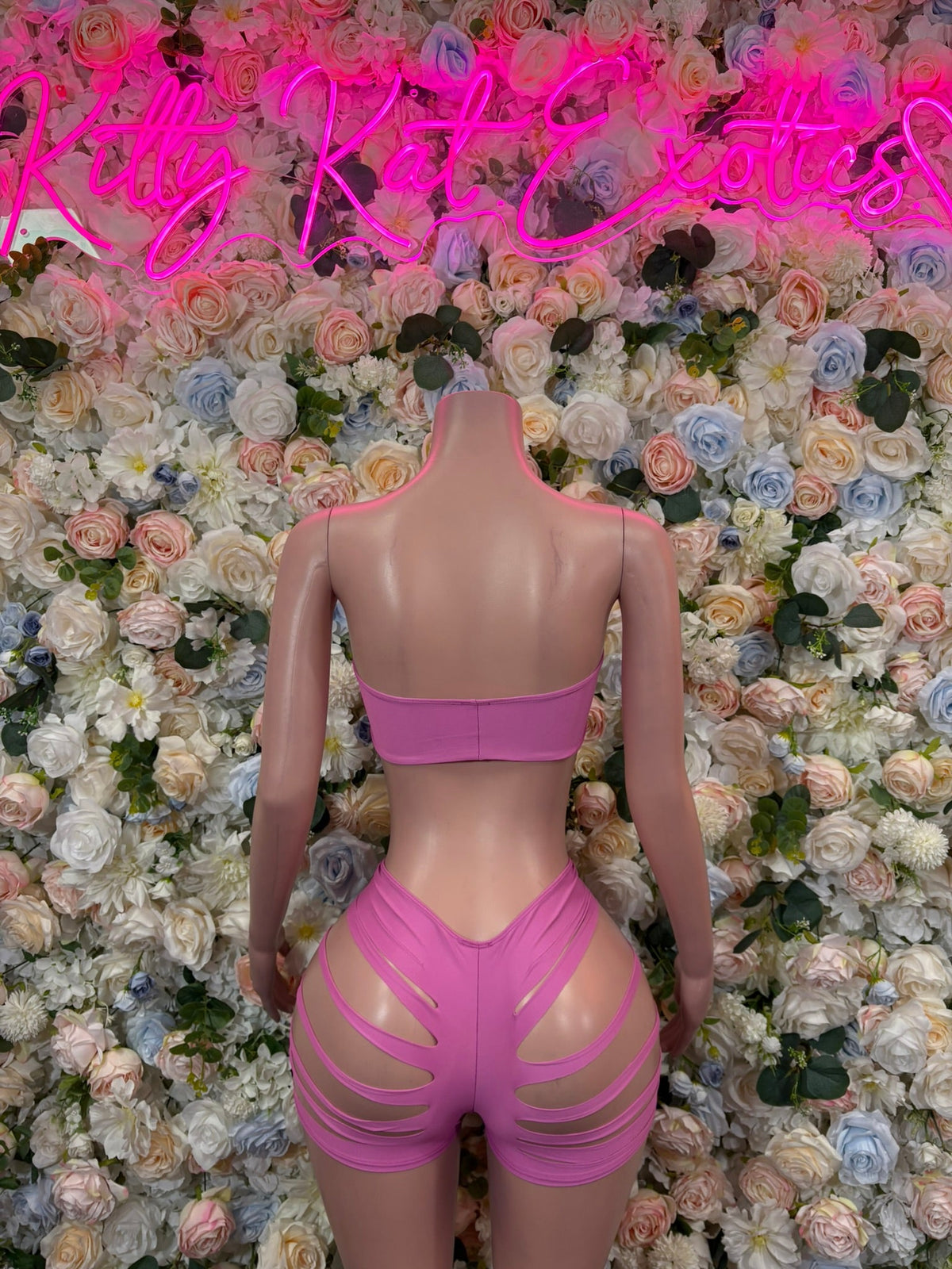 Pink two-piece set with scoop-cutout back bandeau top and high-rise slash shorts