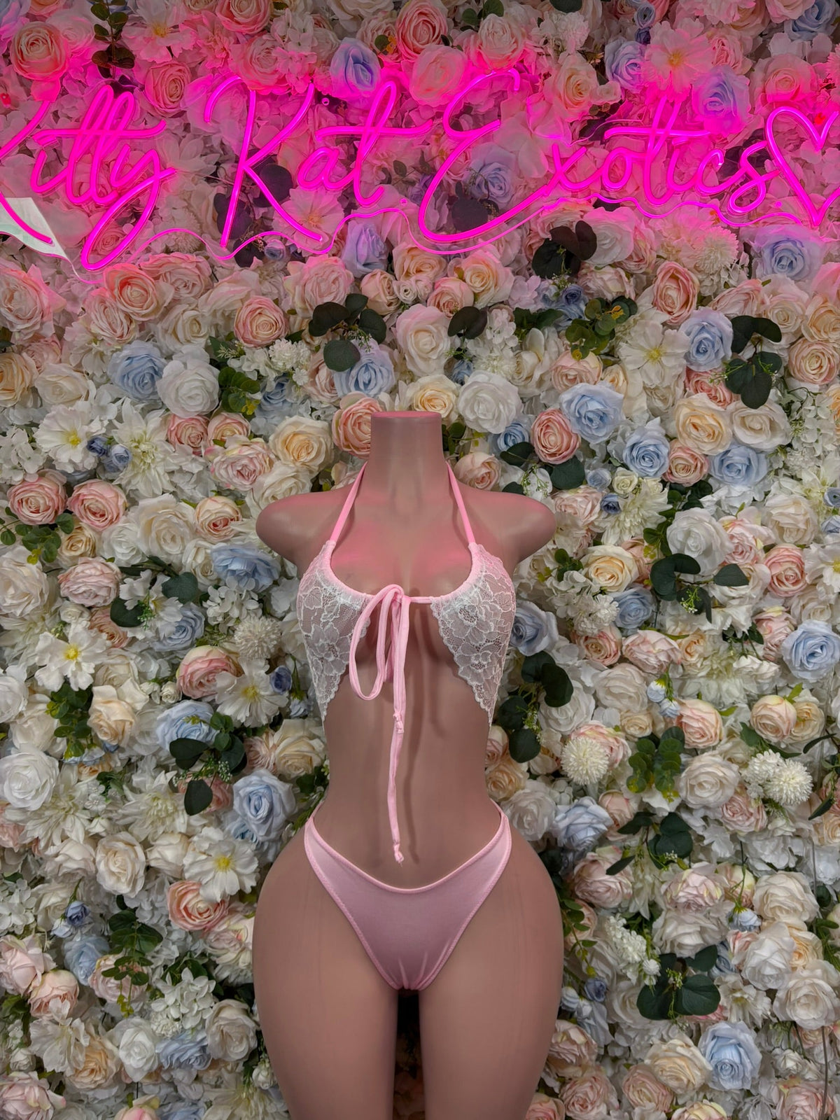 Pink plunge lace bodysuit with thin straps and center bow