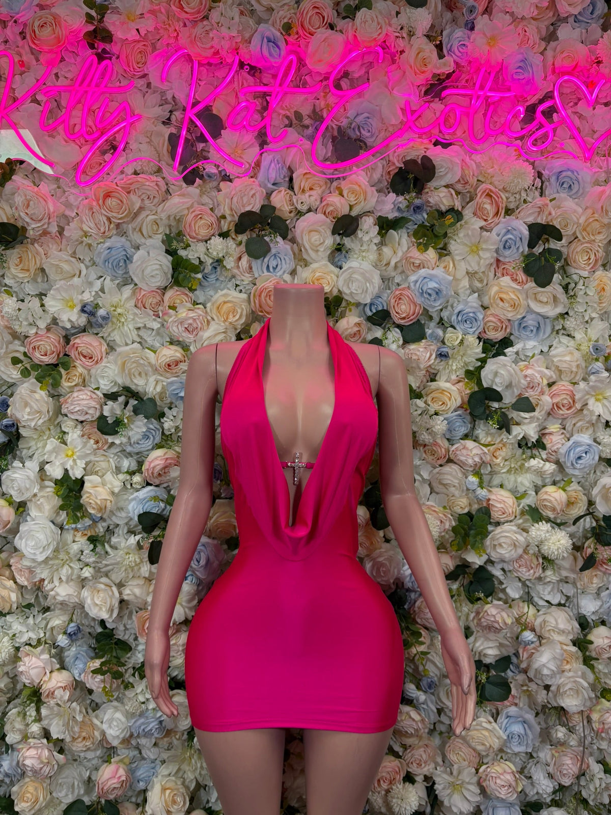 Hot pink plunge backless mini dress with halter-style straps and ruched front