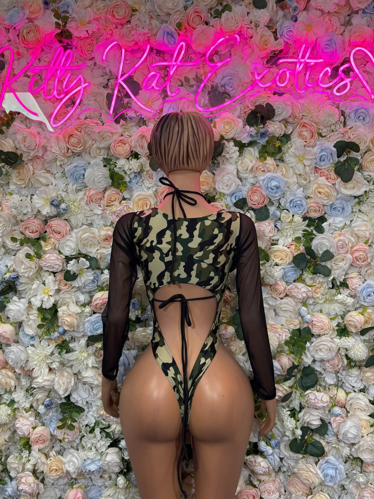 Green camo lace-up cutout one-piece with sheer black sleeves, back strap detail