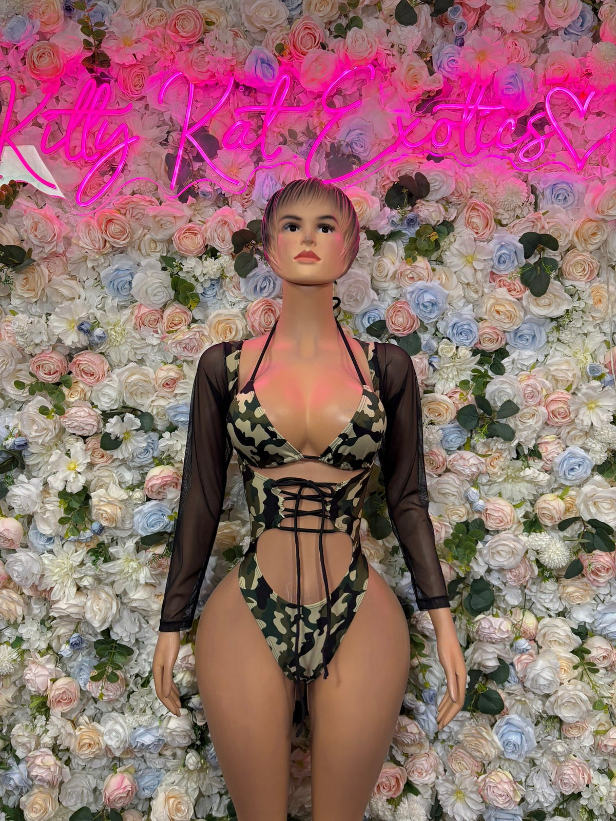 Green camo lace-up cutout one-piece with sheer black sleeves, front tie straps