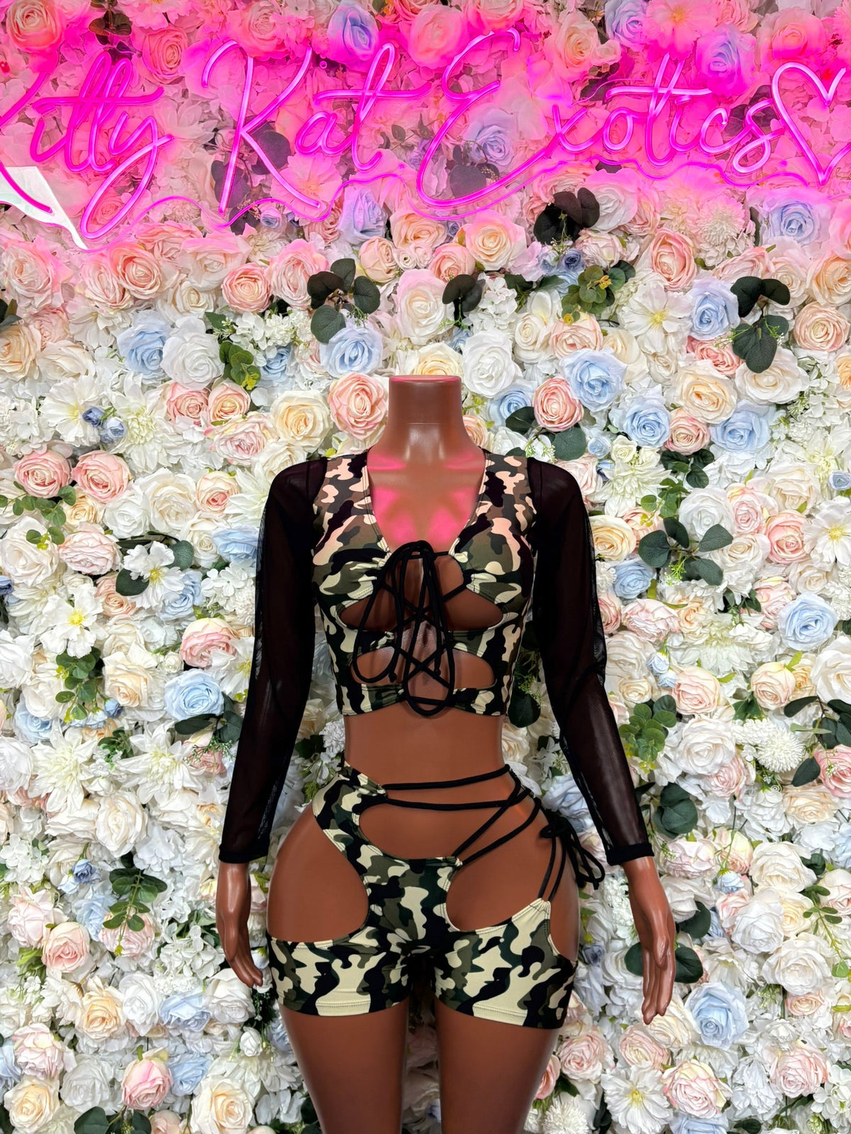 Green camouflage cutout bodysuit with long sleeves and lace-up front straps