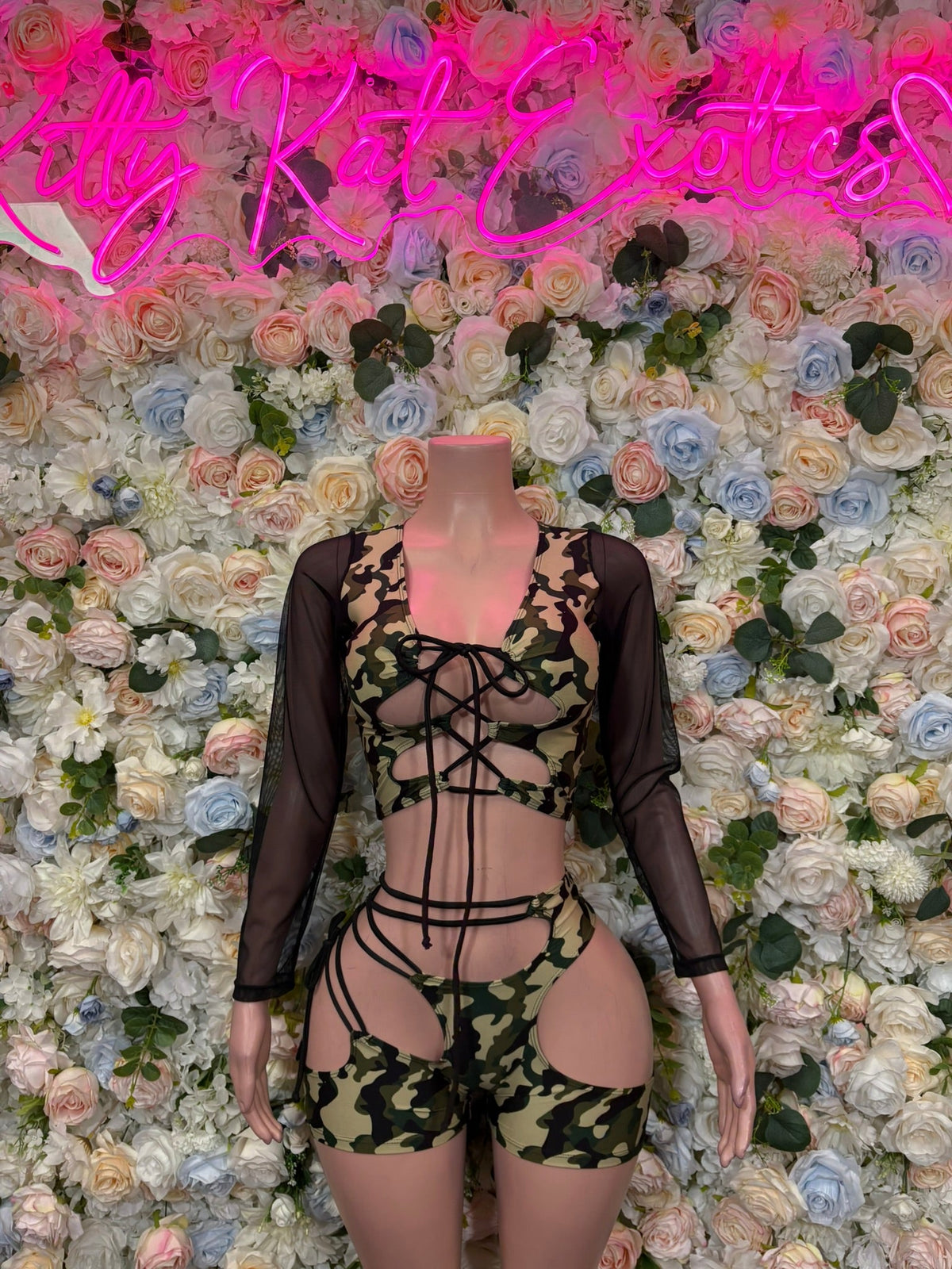 Green camo cutout bodysuit with long sheer sleeves and crisscross front lacing