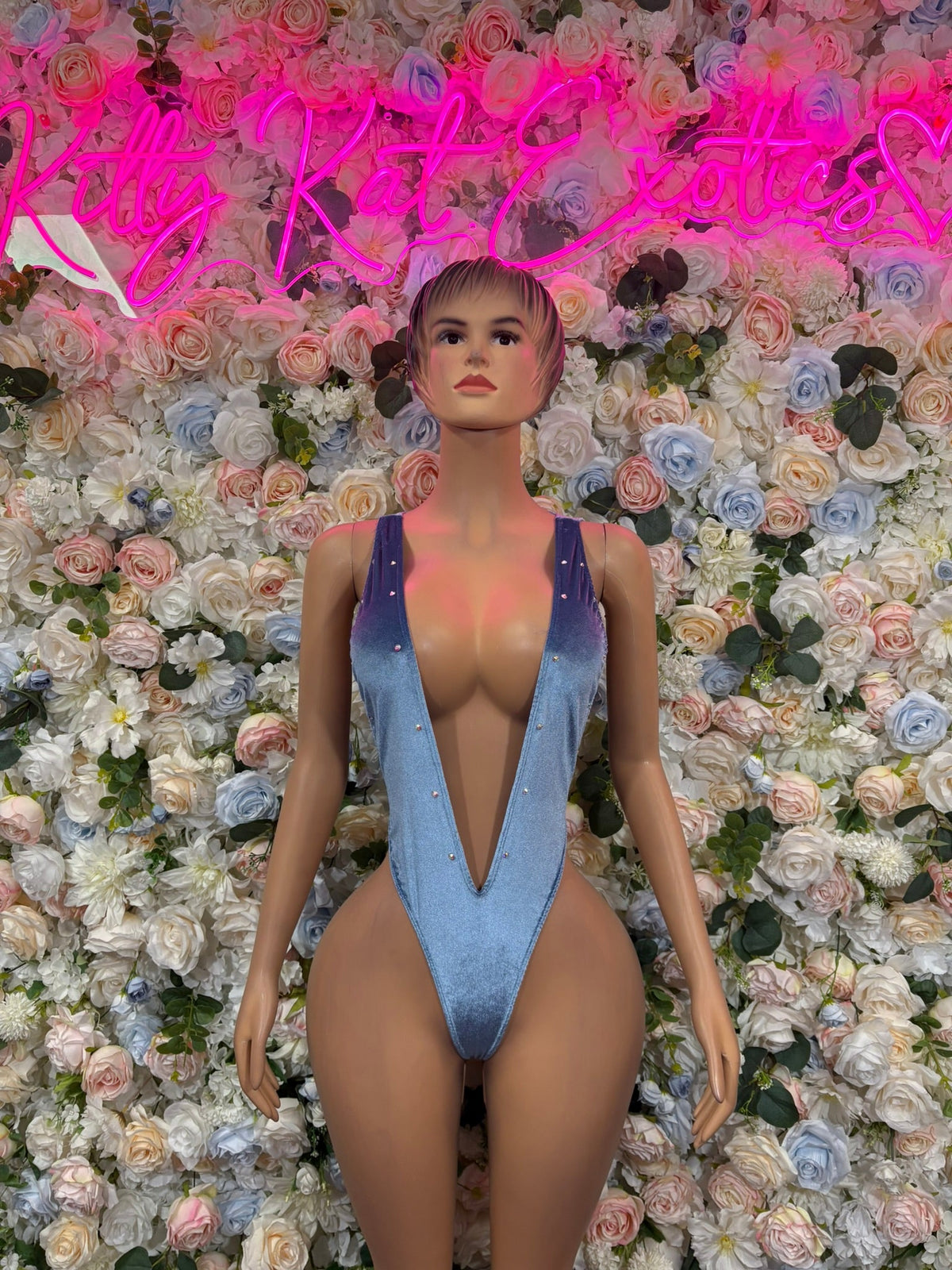 Light blue deep-V one-piece swimsuit with V-neck front and thin shoulder straps