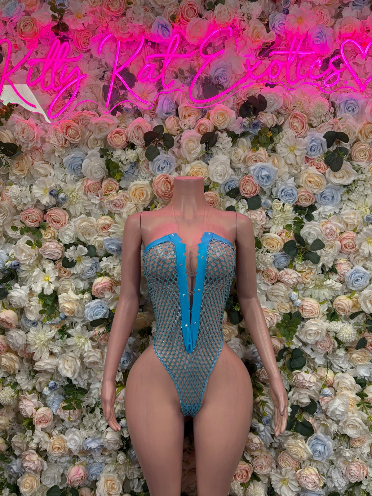 Blue rhinestone mesh corset bodysuit with V neckline and front clasp detail
