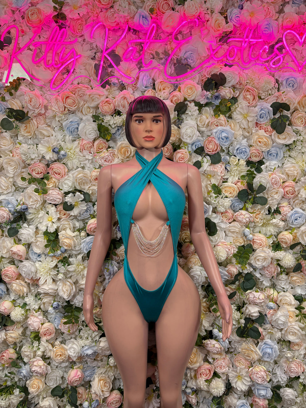 Turquoise drape-front one-piece swimsuit with halter tie and chain detail
