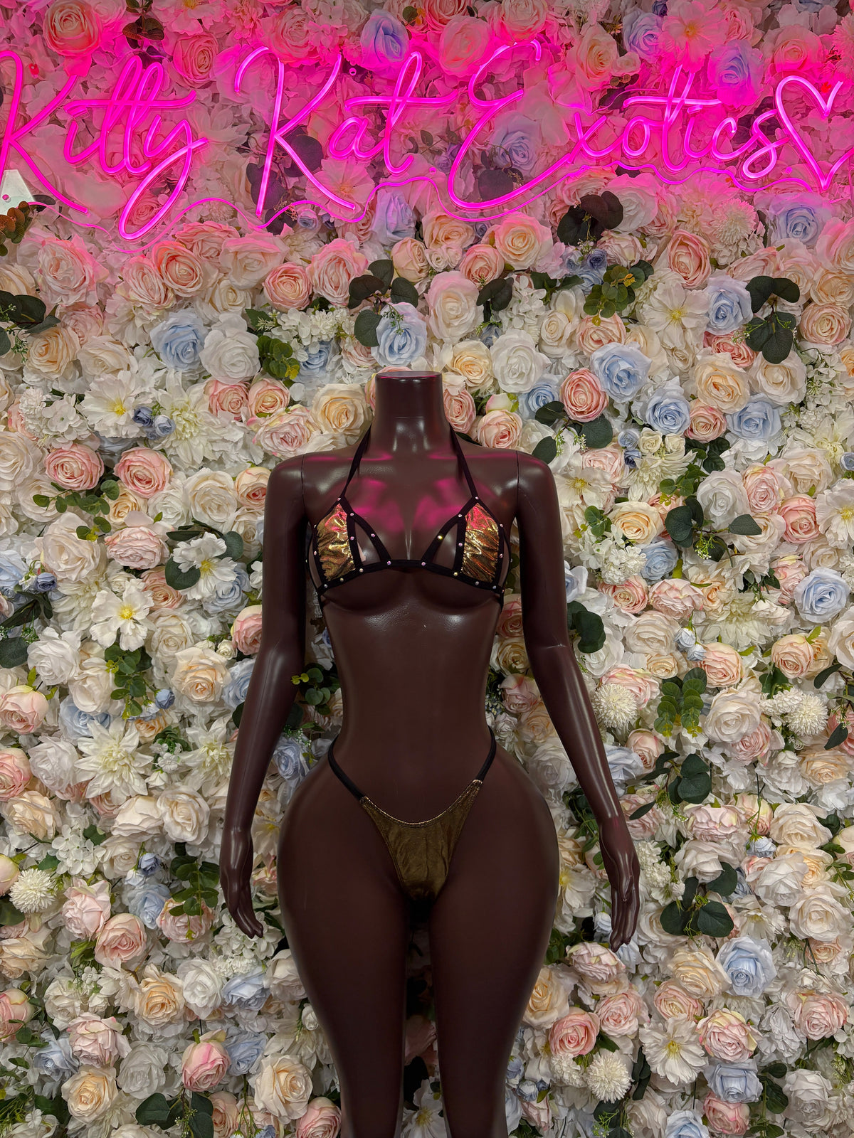 Metallic gold double-strap bodysuit with gold strap detail, front view
